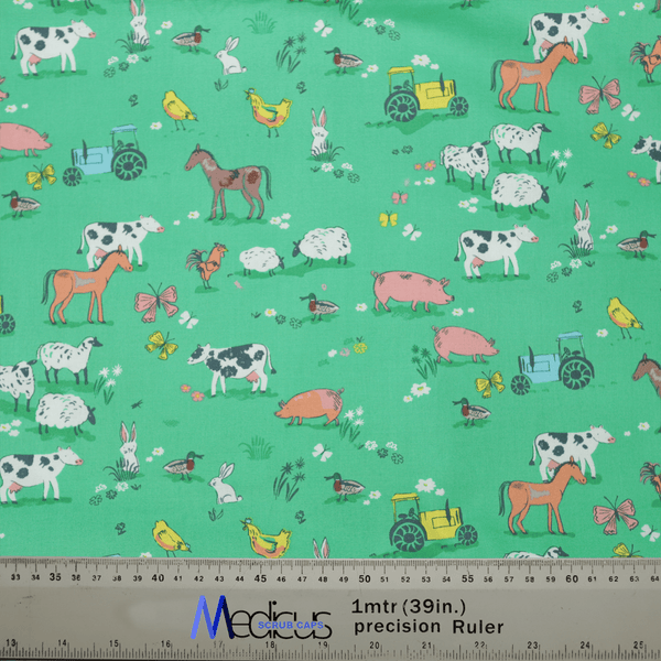 Experience tranquility with the Farmers Field Scrub Cap by Medicus Scrub Caps, made from green fabric featuring farm animals and vehicles like cows, horses, sheep, pigs, rabbits, and more. Measurements in centimeters and inches are included at the bottom for extra comfort.
