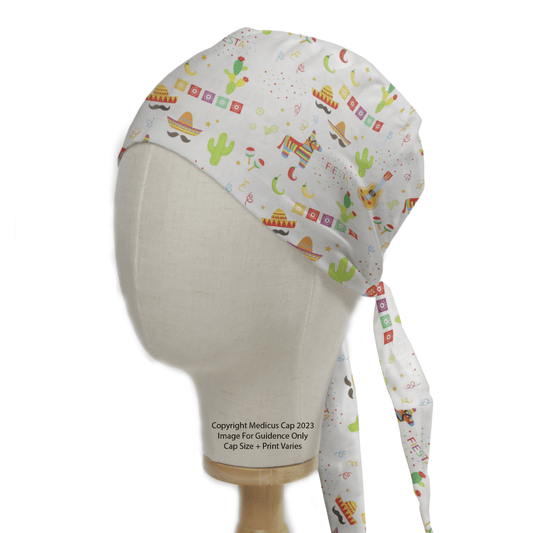 A mannequin head displays the Fiesta Party Scrub Cap by Medicus Scrub Caps, featuring festive prints of sombreros, cacti, maracas, and confetti on a white background. Two long ties drape down the sides, adding a celebratory flair to your medical style in an eco-friendly manner.