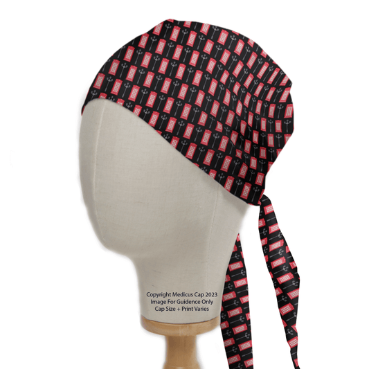 A head mannequin displays the eco-friendly Flag UK Phonebox Scrub Cap by Medicus Scrub Caps, featuring a pattern of small red and black rectangles and long ties at the back for a comfortable fit, blending stylish design with British charm.