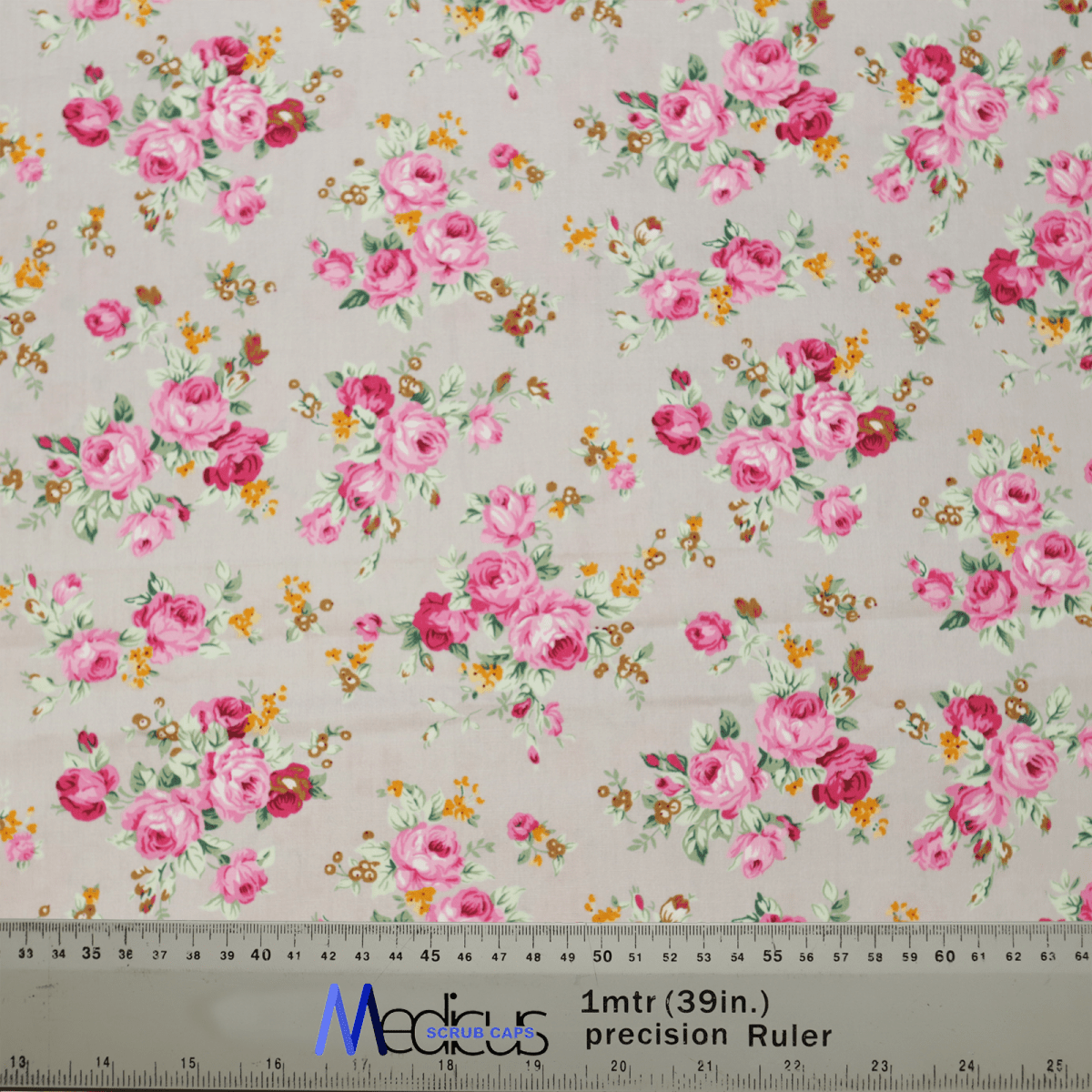 The Floral Bunches Roses Grey Scrub Cap by Medicus Scrub Caps features pink roses and orange flowers on grey fabric, combining elegance and practicality for healthcare professionals.