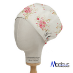 Floral Flower Arrangement Roses White scrub cap shown on mannequin head
