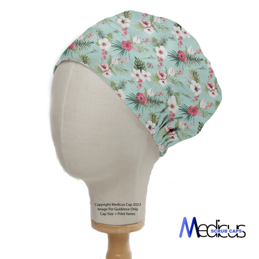 The eco-friendly Floral On Teal Scrub Cap by Medicus Scrub Caps features pink and white flowers with green leaves on light blue, providing a comfortable fit. Displayed on a mannequin, it includes logo and copyright details at the bottom.