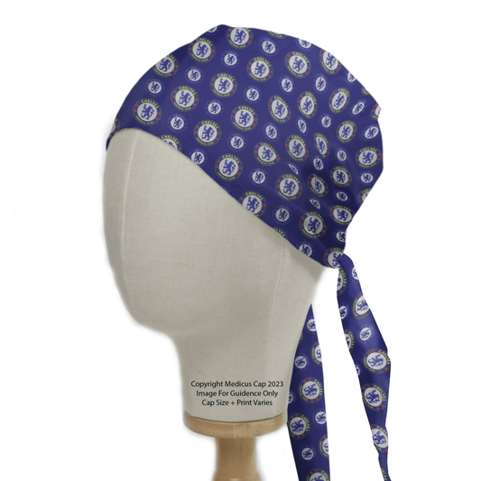 A Football Club Chelsea Scrub Cap from Medicus Scrub Caps adorns the mannequin head, showcasing a purple design with blue and white circular logos. This eco-friendly cap ties at the back, elegantly draping on one side.