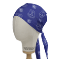 The Medicus Scrub Caps Football Club Everton Scrub Cap, featuring white club logos on a blue eco-friendly fabric, is displayed on a mannequin head with side and front views. Ties drape to the side, and text offers copyright info and guidance for this inclusive sizing option.