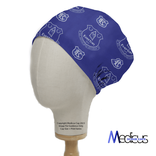 The Football Club Everton Scrub Cap by Medicus Scrub Caps is shown on a mannequin head, featuring inclusive sizing and the Everton crest pattern with the brand logo at the bottom right.