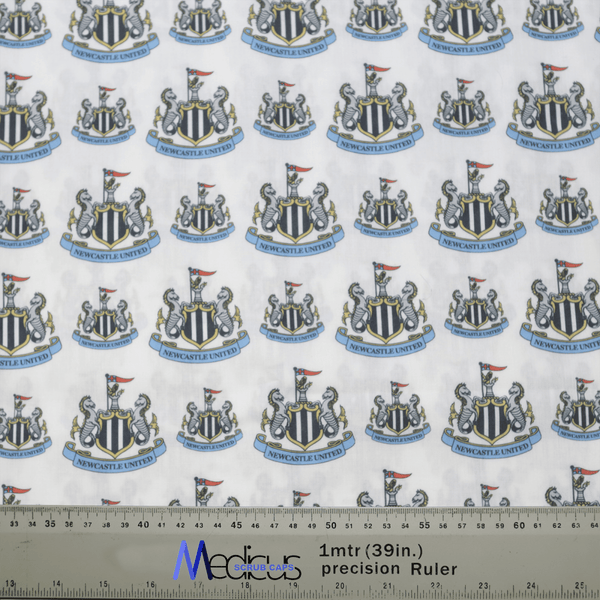 The Football Club Newcastle Scrub Cap by Medicus Scrub Caps features patterned fabric with club crests, black and white shields, lions, and flags. A 1-meter ruler at the bottom symbolizes sustainability and healthcare excellence.