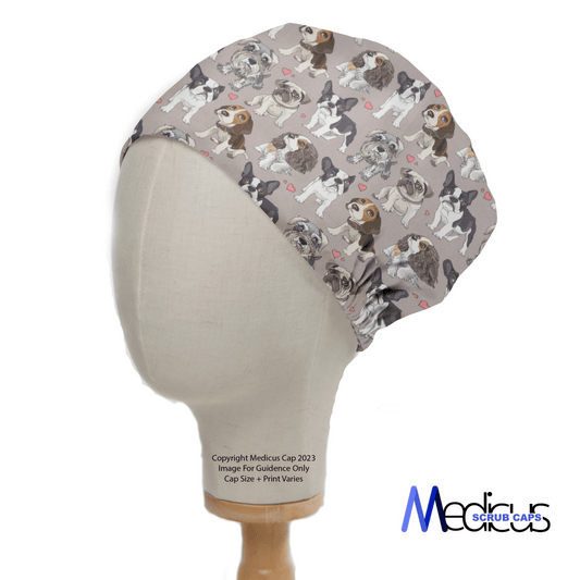 Side view of a mannequin head wearing Medicus Scrub Caps For The Love Of Dogs scrub cap, featuring cartoon dogs on a grey background.