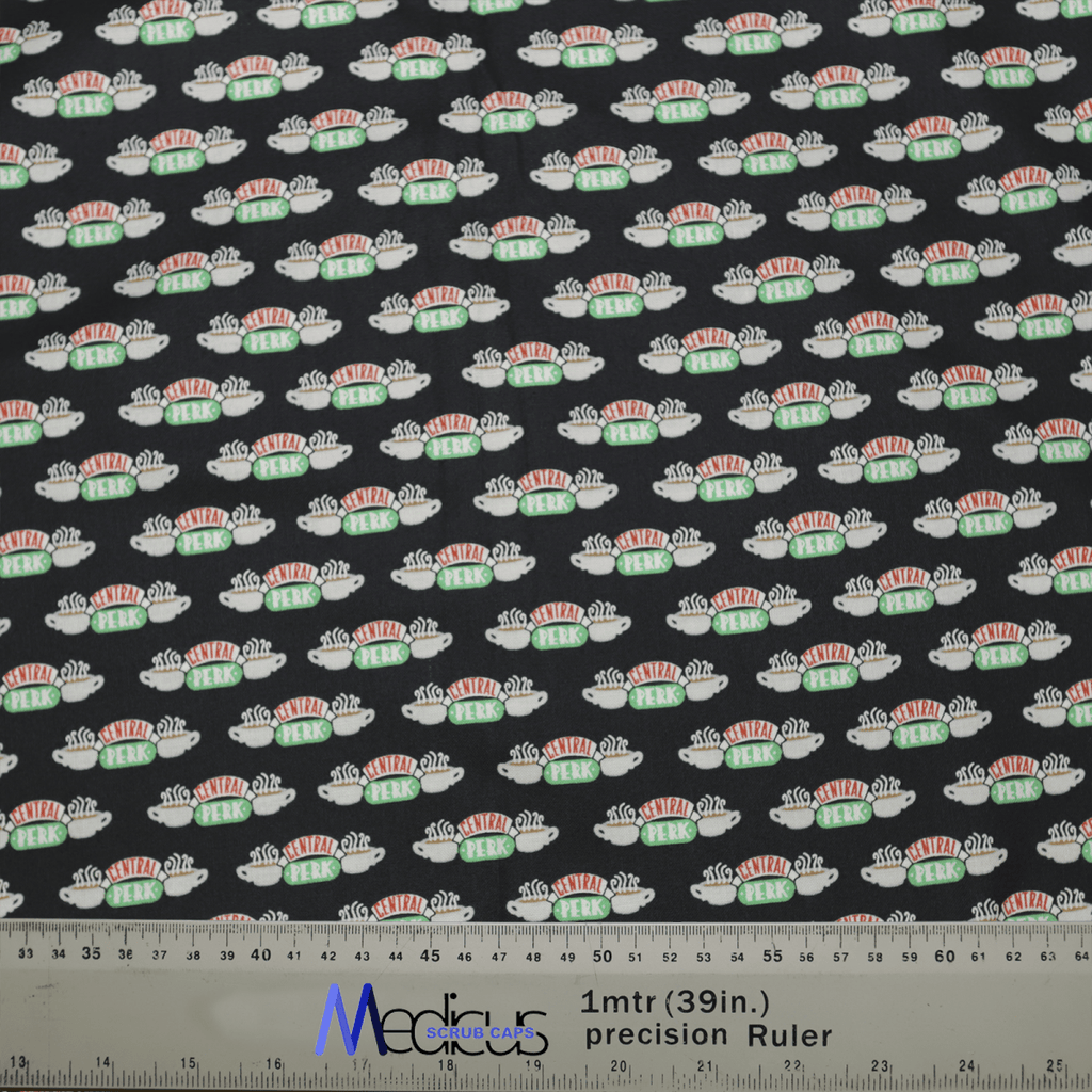 The Friends Central Perk Scrub Cap by Medicus Scrub Caps features small sushi roll illustrations on a black backdrop. Charming and functional, this eco-friendly fabric is perfect for crafting, complete with a blue precision ruler marked 1mtr (39in) at the bottom. A sustainable choice for creative projects.