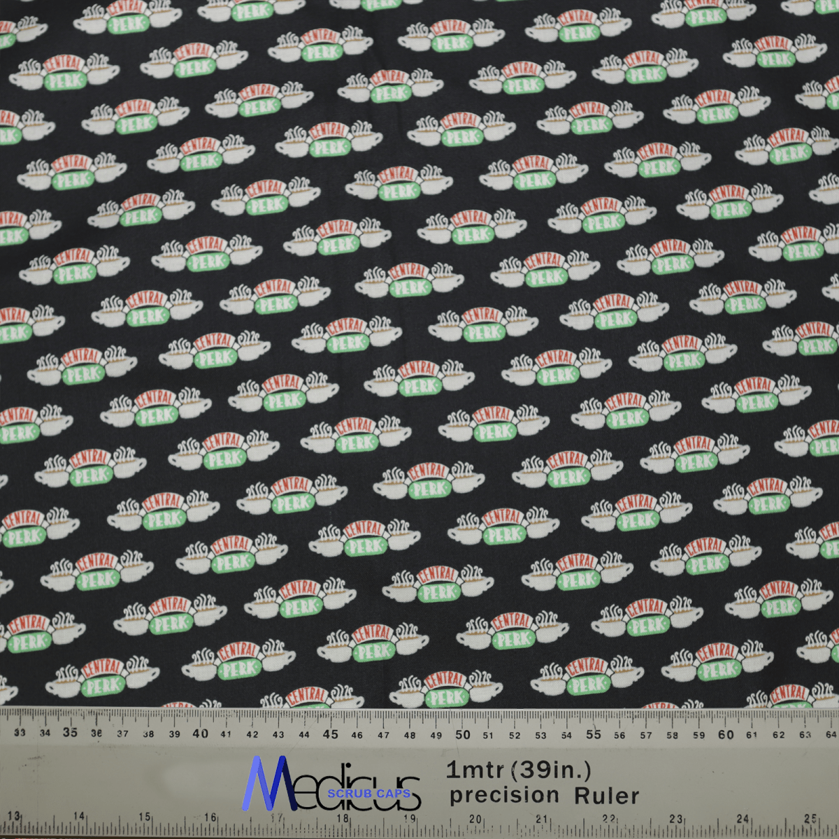 The Friends Central Perk Scrub Cap by Medicus Scrub Caps features small sushi roll illustrations on a black backdrop. Charming and functional, this eco-friendly fabric is perfect for crafting, complete with a blue precision ruler marked 1mtr (39in) at the bottom. A sustainable choice for creative projects.