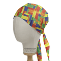The Medicus Scrub Caps Games Lego Tetris Large Scrub Cap features an eco-friendly design with vibrant interlocking bricks in red, blue, yellow, green, and orange. Adjustable ties at the back ensure a perfect fit, as showcased on a mannequin head.