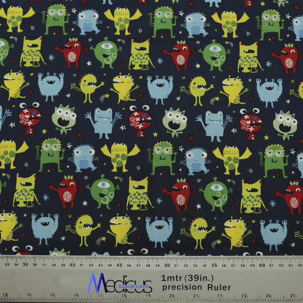Introducing the Germ Monsters #2 Scrub Cap by Medicus Scrub Caps, an eco-friendly healthcare essential featuring colorful cartoon monsters with varied expressions and shapes on a dark background. A ruler at the bottom provides measurements in centimeters and inches.
