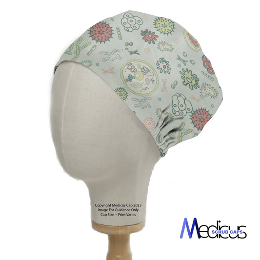 Side view of a mannequin head wearing an eco-friendly Medicus Scrub Caps scrub cap called Germs Bacteria Monsters Goo. It showcases a colorful bacteria and virus print on a light background, is reusable, ties at the back, with the logo Medicus Scrub Caps in the lower right corner.