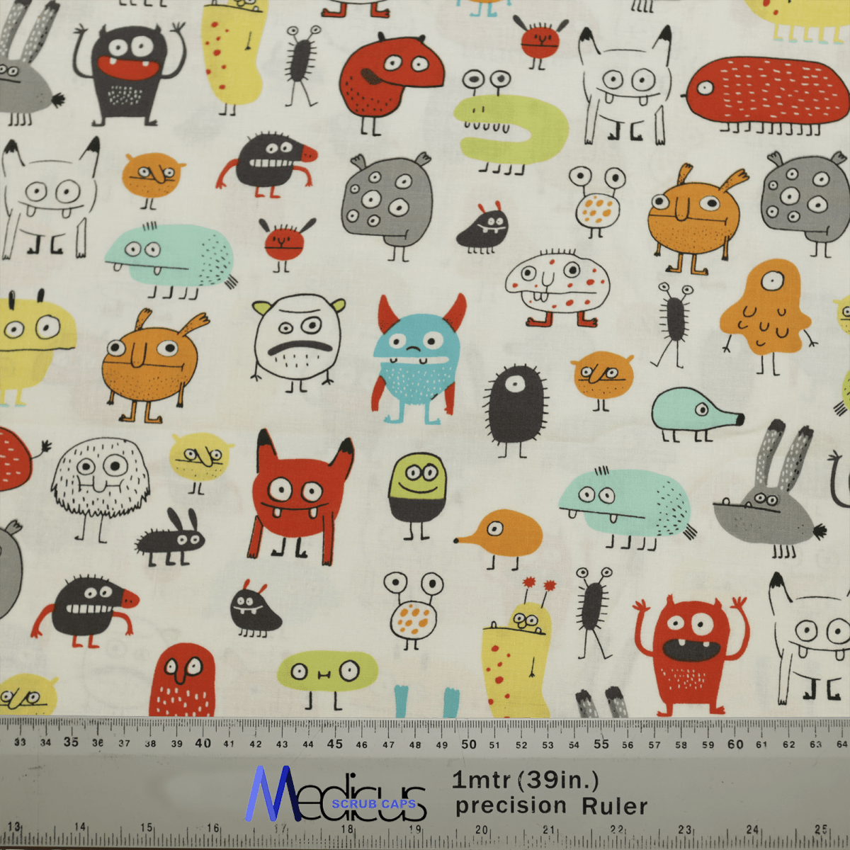 The Germs Monster Scrub Cap by Medicus Scrub Caps showcases cartoon-style monster germs with various expressions on a light backdrop, complete with a Med@Me ruler for easy centimeter and inch measurements, ideal for creating sustainable and playful eco-friendly scrub hats.