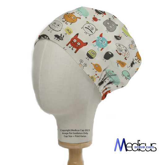 A mannequin head showcases the whimsical Germs Monster Scrub Cap by Medicus Scrub Caps, adorned with colorful, cartoon-style creatures on a white background. Text notes cap size and print may vary, highlighting its eco-friendly and reusable design.