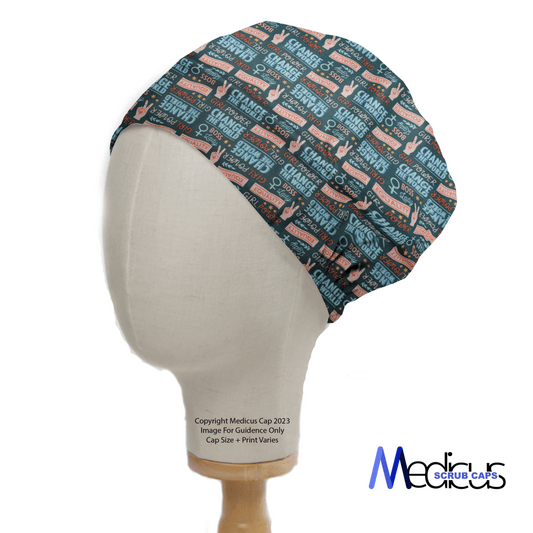 A mannequin head displays the Girl Power Change The World scrub cap, featuring playful text like Girl Power and Stay Strong, with colors in blue, peach, and black. Ideal for healthcare professionals, it elegantly includes the brand name Medicus Scrub Caps at the bottom.