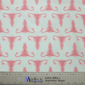 The Gynecology Surgeon Scrub Cap by Medicus Scrub Caps is crafted from handmade fabric with pink uterus designs on a light background. A ruler in meters and inches ensures precision for reusable creations, perfect for unique surgeon scrub caps.