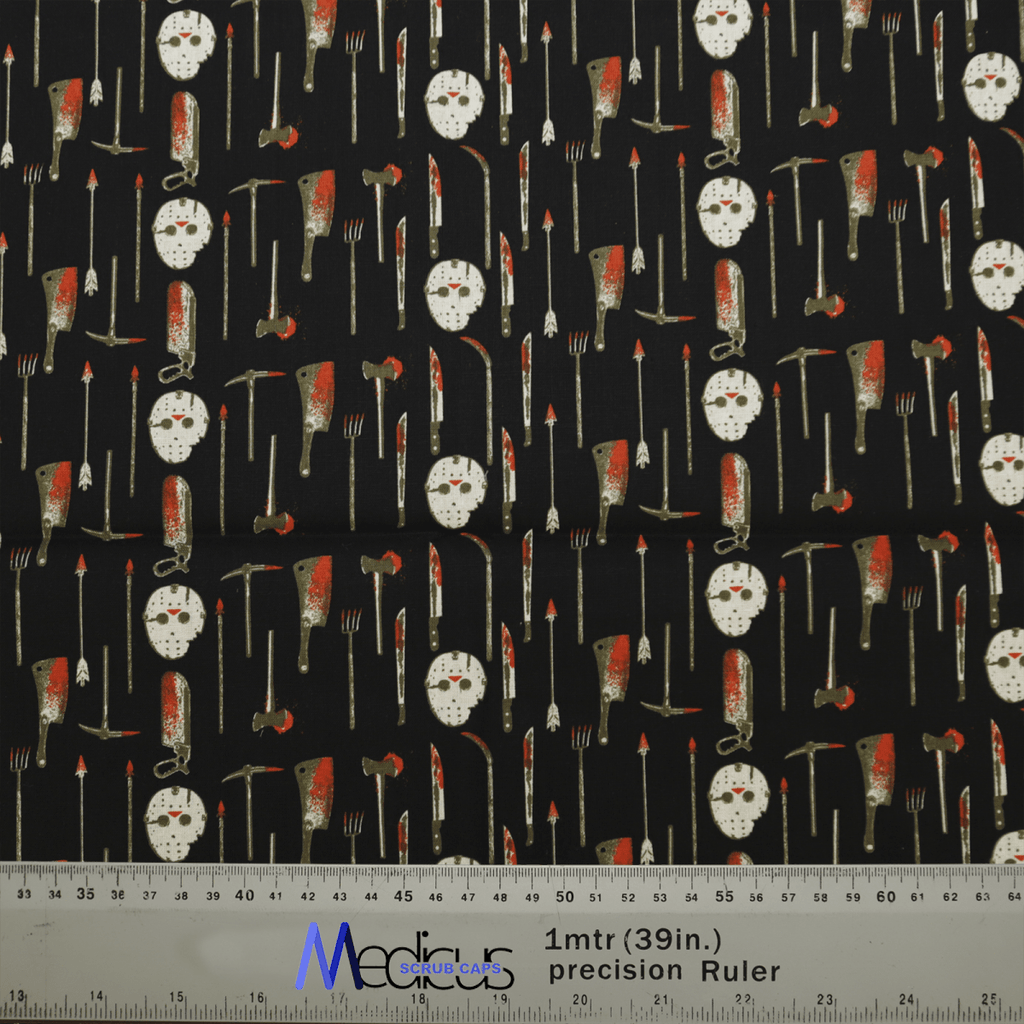 The black fabric of Medicus Scrub Caps Halloween Jason Hockey Mask + Knives design features a spooky pattern of kitchen utensils, bloody cleavers, forks, and knives—ideal for horror fashion lovers. A ruler at the bottom ensures precise cutting measurements.