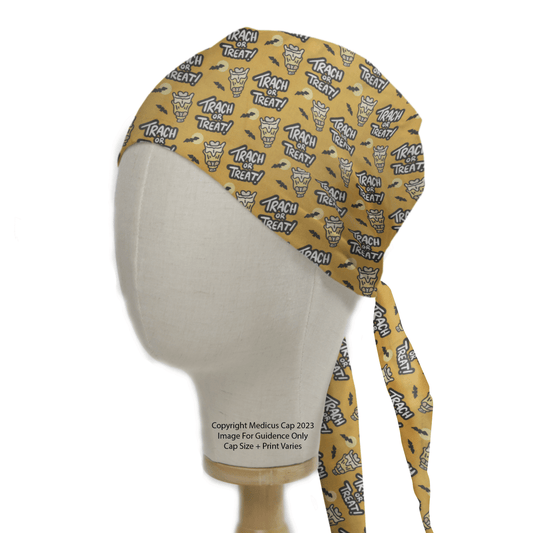 The mannequin head features a Medicus Scrub Caps Halloween Tract Or Treat scrub cap that is eco-friendly, yellow, and adorned with cartoon cat illustrations and the Trach or Treat! phrase, adding a festive touch to your medical attire.