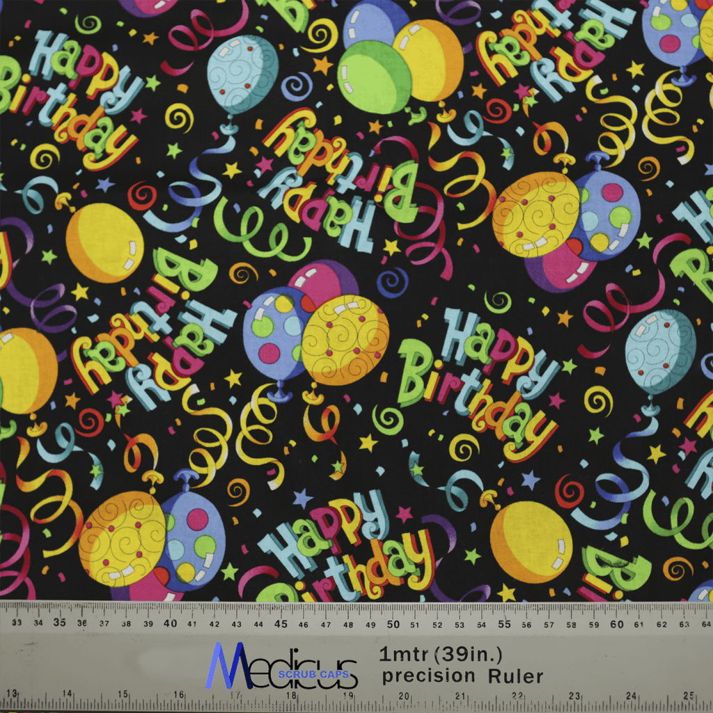 The Medicus Scrub Caps Happy Birthday scrub cap features a vibrant pattern of balloons, stars, and streamers on black. Ideal for healthcare workers, this eco-friendly cap also has a ruler at the bottom to indicate size.