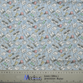 The Happy Teeth Braces Scrub Cap by Medicus Scrub Caps boasts a delightful fabric with cartoon teeth, toothbrushes, toothpaste tubes, and dental floss on a light blue background. It also features a ruler on the bottom edge with measurements in inches and centimeters for added dental flair.