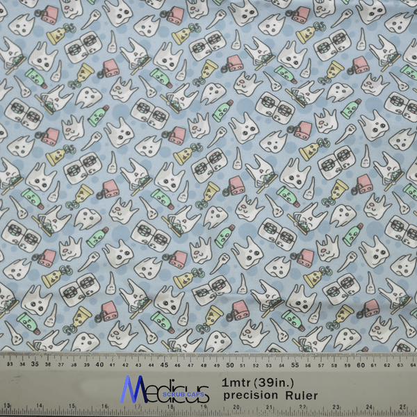 The Happy Teeth Braces Scrub Cap by Medicus Scrub Caps boasts a delightful fabric with cartoon teeth, toothbrushes, toothpaste tubes, and dental floss on a light blue background. It also features a ruler on the bottom edge with measurements in inches and centimeters for added dental flair.
