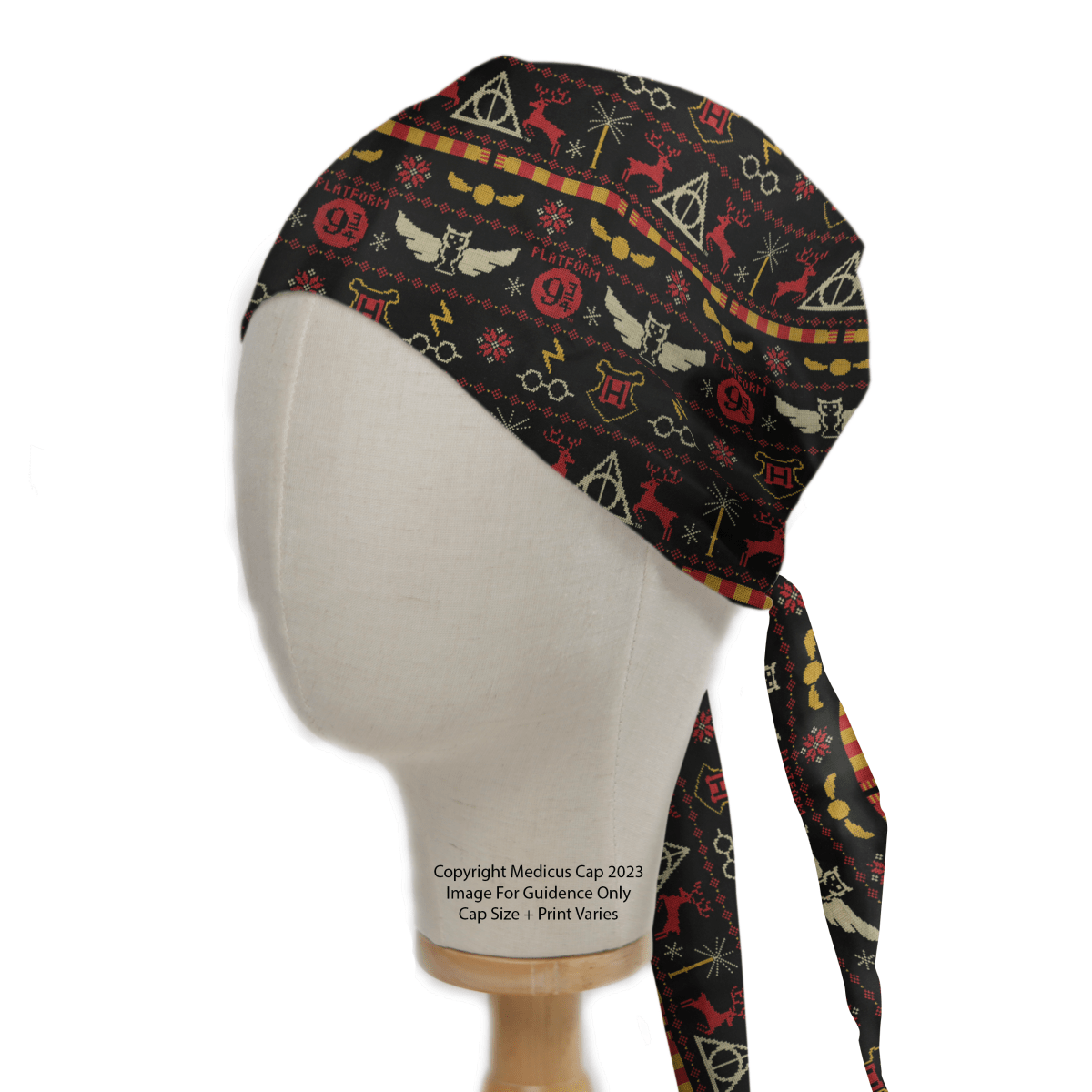 A mannequin head displays the eco-friendly Harry Potter Christmas Jumper Scrub Cap by Medicus Scrub Caps, featuring a whimsical black and red design with enchanting owls, lightning bolts, deer, snakes, and magical symbols. Perfect for fans of magical healthcare attire.