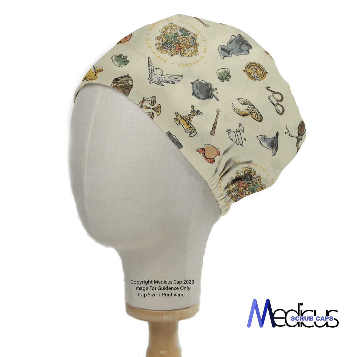 A mannequin displays a sustainable Medicus Scrub Cap with a Harry Potter-inspired crest, cauldron, and wand design on beige fabric, blending magic and functionality.