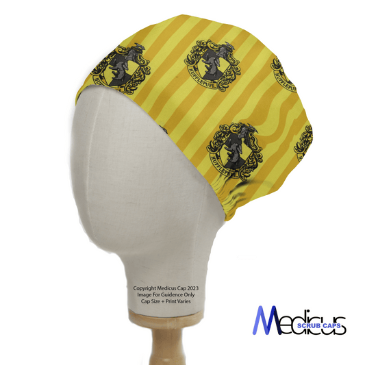 The Harry Potter Hufflepuff Scrub Cap by Medicus Scrub Caps features a yellow medieval-style emblem with a badger, diagonal stripes, and their logo. This eco-friendly scrub cap is both practical and stylish, ideal for fans seeking reusable options.