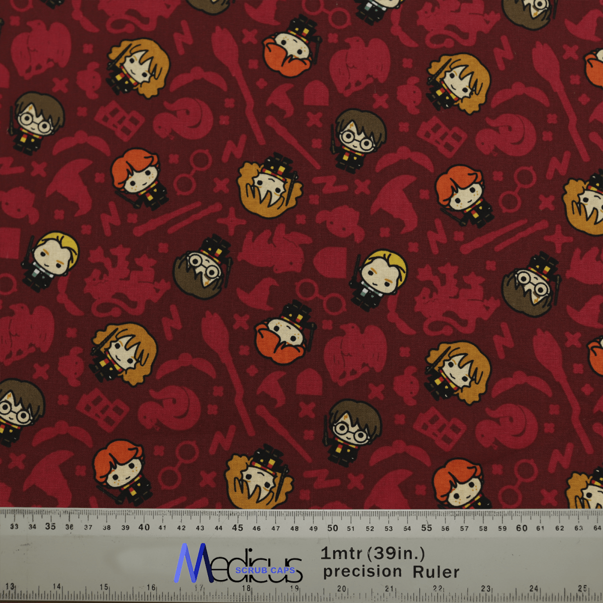 Medicus Scrub Caps Harry Potter Kawaii Characters Red Scrub Cap features cute wizarding characters and symbols on a red background, with a ruler for scale.