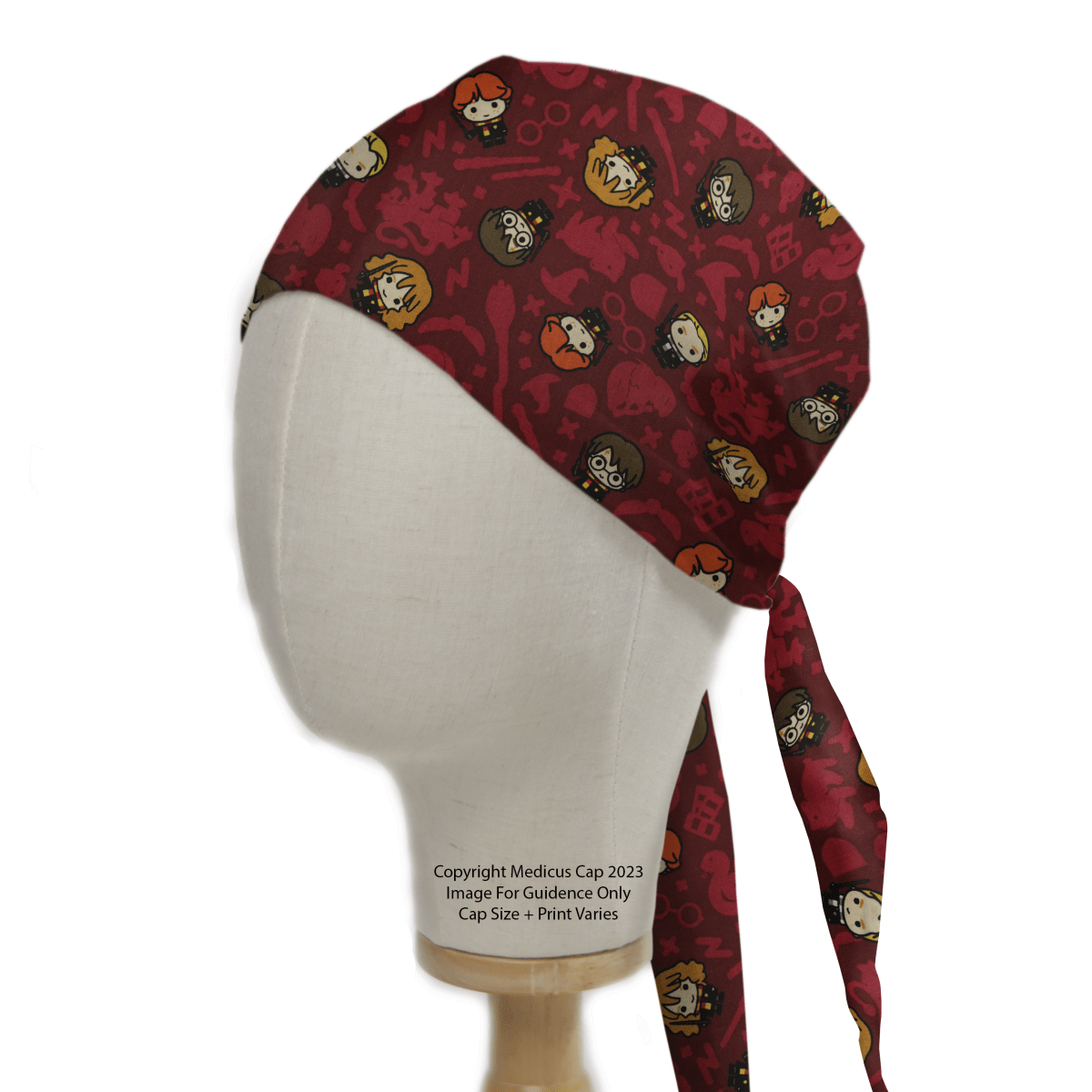 A Harry Potter Kawaii Characters Red Scrub Cap from Medicus Scrub Caps on a mannequin head, featuring cute character faces and symbols. Tied at the back.