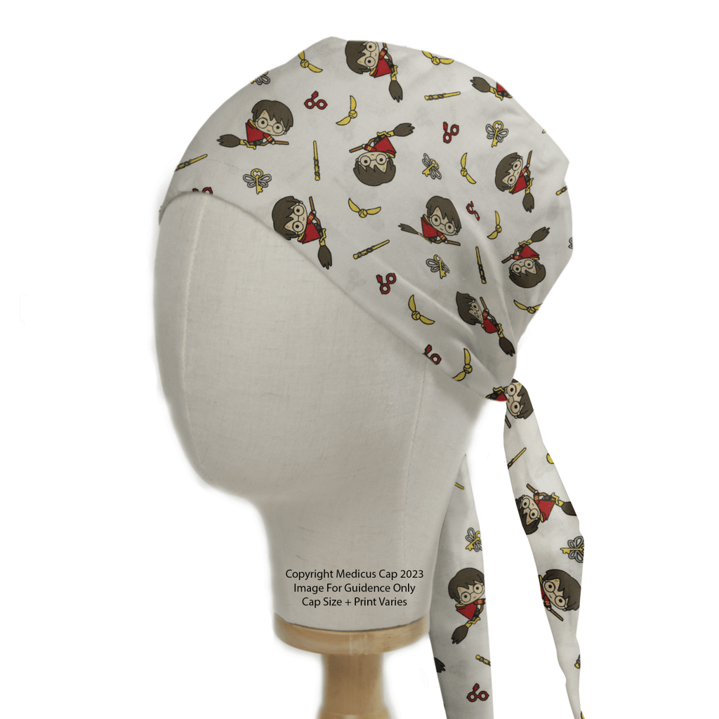 A Medicus Scrub Caps mannequin showcases the sustainable Harry Potter Quidditch Scrub Cap, featuring whimsical designs of a character with round glasses, scissors, and golden snitches. Tying at the back and elegantly displayed on wood, its a must-have for fans.