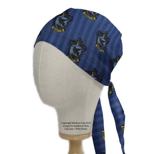 The Harry Potter Ravenclaw Scrub Cap by Medicus Scrub Caps, shown on a mannequin, showcases black ravens, yellow scrolls, and crests on vertical stripes. The stylishly tied back enhances its eco-friendly appeal.