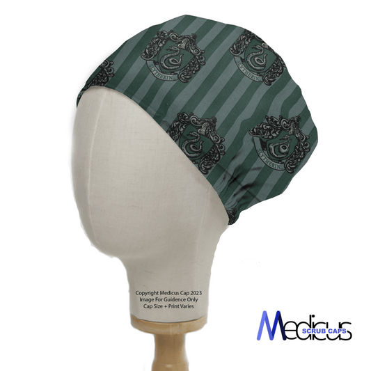 A mannequin head displays the Harry Potter Slytherin Scrub Cap with dark stripes and a detailed black and gray crest, while Medicus Scrub Caps in the corner emphasizes its eco-friendly design.