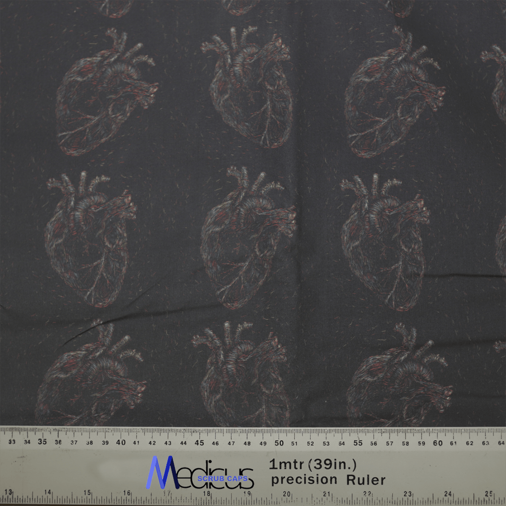 The Heart Faded On Black Scrub Cap by Medicus Scrub Caps features anatomically detailed hearts on dark fabric. A ruler shows it measures about 39 inches.