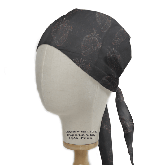 Heart Faded On Black Scrub Cap from Medicus Scrub Caps, featuring a subtle anatomical heart pattern on dark fabric. Stylish and professional for medical professionals.