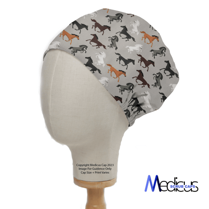 The Horses On Grey Scrub Cap by Medicus Scrub Caps features a vibrant horse pattern on gray, modeled by a mannequin head. Ideal for healthcare professionals, the cap subtly displays the Medicus logo in the bottom right, merging function with equestrian elegance.