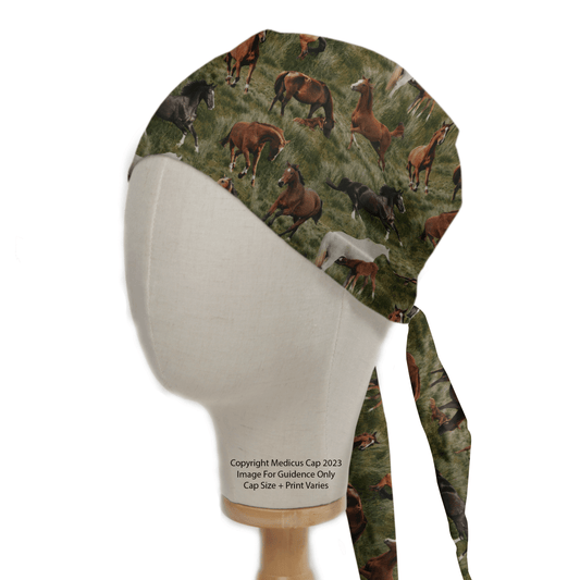 A Medicus Scrub Caps mannequin head displays the eco-friendly Horses Roaming Free Scrub Cap, featuring a detailed design of horses on grass, tied at the back with long straps.