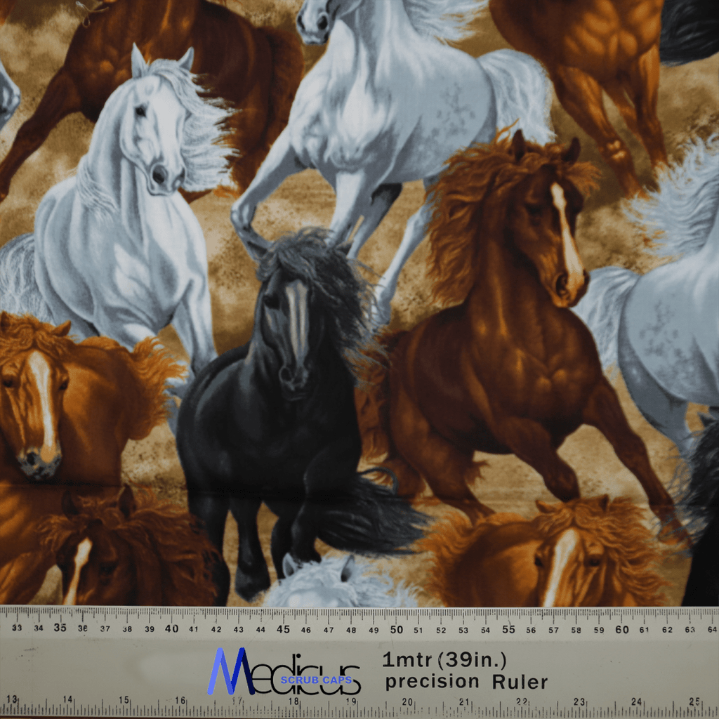 The eco-friendly fabric of the Medicus Scrub Caps Horses Run Wild pattern showcases galloping horses in white, black, and brown. A 1-meter (39-inch) ruler at the bottom highlights its scale, perfect for crafting a stylish scrub cap.