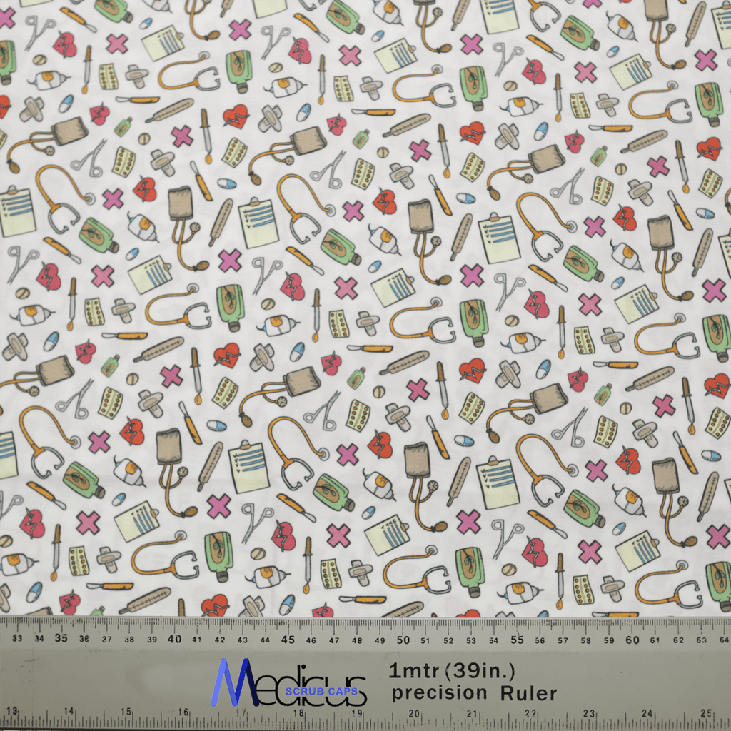 The Hospital Tools On White #2 Scrub Cap by Medicus Scrub Caps features medical-themed illustrations like stethoscopes, syringes, and bandages on a white background with colorful elements. A ruler at the bottom highlights the detail in these sustainable designs.