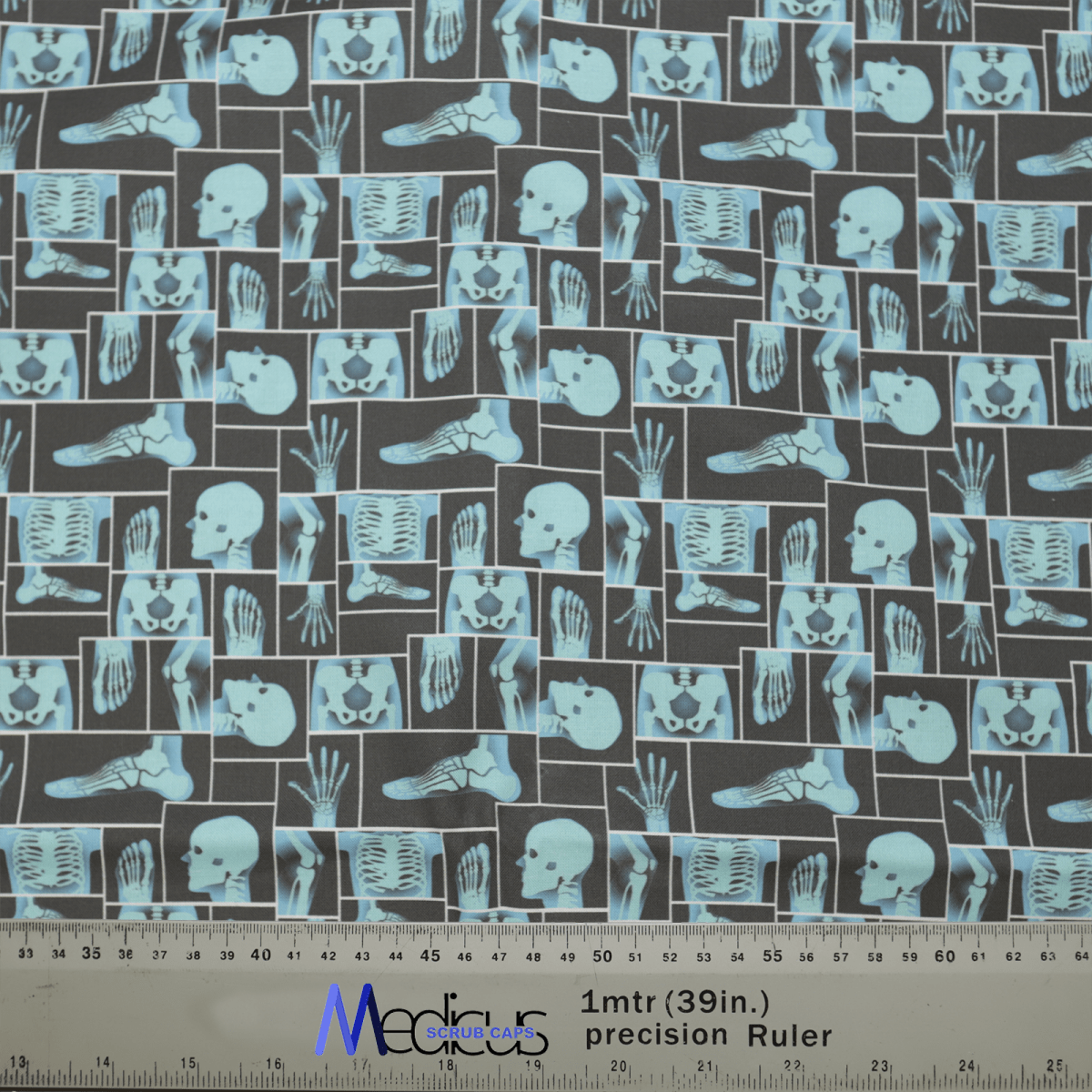 The Human Body Xray Blue Grid Scrub Cap by Medicus Scrub Caps features a dark fabric with medical X-ray imagery of skulls, hands, feet, and spines.