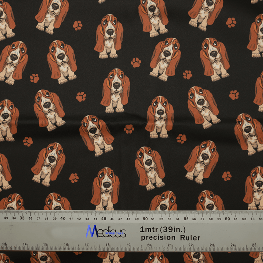 The Hush Puppies Dog Scrub Cap by Medicus Scrub Caps features a playful pattern of cartoon basset hounds and paw prints on black, perfect for crafting. A ruler showing 1 meter (39 inches) at the bottom ensures precise cuts.