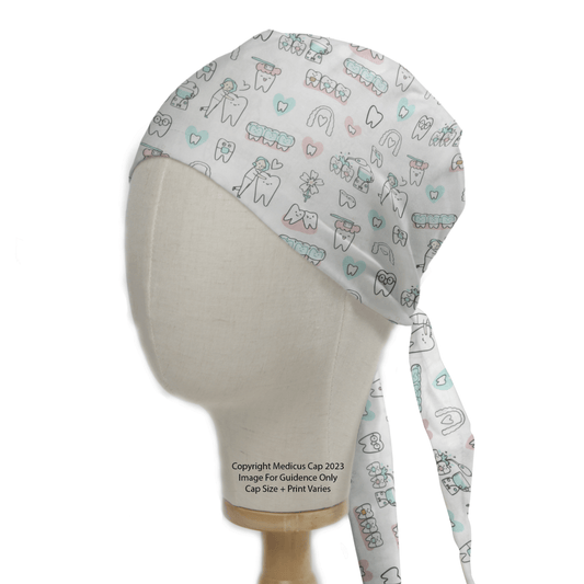 Side view of a mannequin head wearing the Hygienist Teeth Cleaning White Scrub Cap by Medicus Scrub Caps, featuring whimsical pastel illustrations of teeth, toothbrushes, dental tools, and hearts. A label with copyright information is visible on the material.