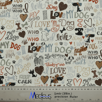 The Medicus Scrub Caps I Love My Dogs Scrub Cap showcases a charming fabric design with dog-themed phrases like I love my dog and sloppy kisses, along with adorable illustrations of dogs, hearts, paw prints, and bones—ideal for veterinary professionals. A ruler offers size reference.