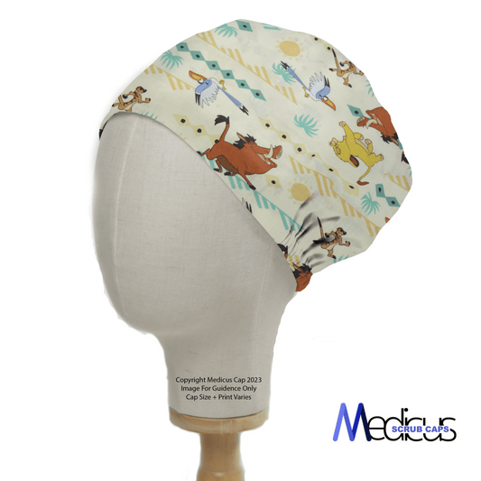 The Lion King Timone And Pumba Scrub Cap from Medicus Scrub Caps is showcased on a display head. It features playful animal and abstract patterns, colorful illustrations reminiscent of the Lion King, and the logo at the bottom, offering a comfortable fit against its light background.