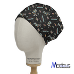 A mannequin head models a black Medicus Scrub Caps Looney Tunes Marvin The Martian Scrub Cap, showcasing space-themed illustrations like astronauts, planets, and the word GEGENS. The caps side view displays logos and copyright text.