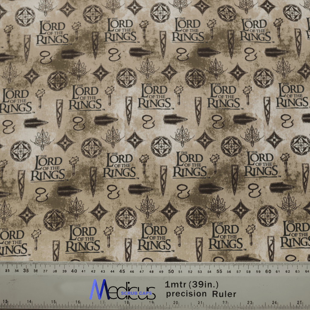 The Lord Of The Rings Titles Scrub Cap by Medicus Scrub Caps features eco-friendly fabric adorned with repeated Lord of the Rings logos, swords, rings, and mystical symbols on a beige background. A ruler at the bottom measures up to 1 meter or 39 inches in size.