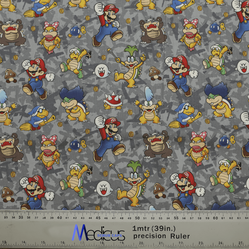 The Medicus Scrub Caps Mario Bowser Grey Scrub Cap features vibrant video game characters on a gray background, blending fun and function for medical professionals.