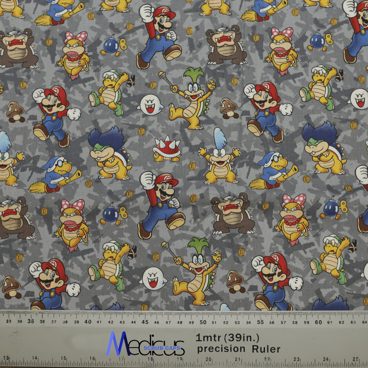 The Medicus Scrub Caps Mario Bowser Grey Scrub Cap features vibrant video game characters on a gray background, blending fun and function for medical professionals.