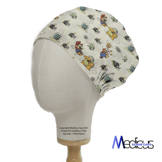 The Medicus Scrub Caps Mario Super Bowser Bombs scrub cap features colorful video game characters and bomb motifs on a white background, perfect for healthcare professionals.