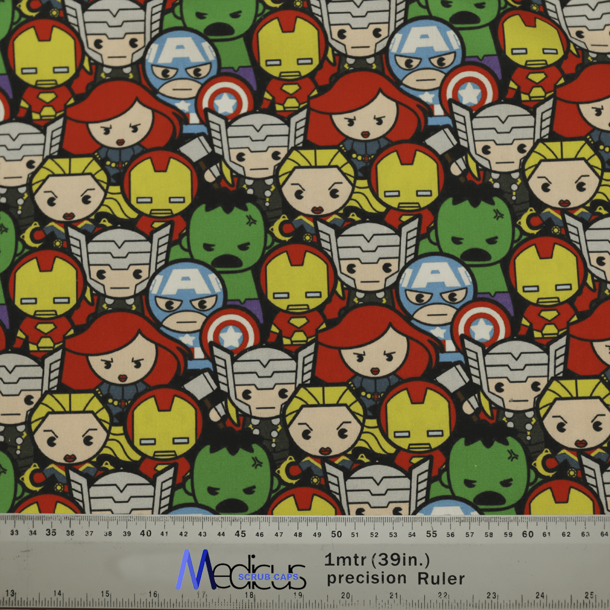 The Marvel Avengers Cartoon #2 Scrub Cap by Medicus Scrub Caps features chibi-style superheroes with exaggerated heads in colorful costumes forming a grid, ideal for any fan. A measurement ruler is displayed at the bottom of the image.